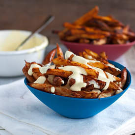 Baked Spicy Fries with Garlic Cheese Sauce