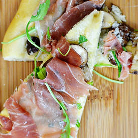 Prosciutto, mushroom and truffle oil pizza