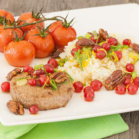 Pecans with rice and oven baked tomatoes