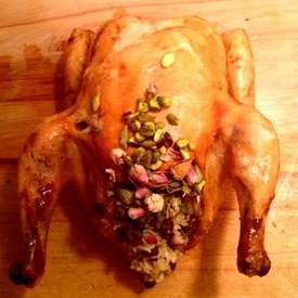 Roasted Chicken Stuffed with Pistachio, Rose, Drie